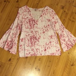 A tie dye print bell-sleeved blouse